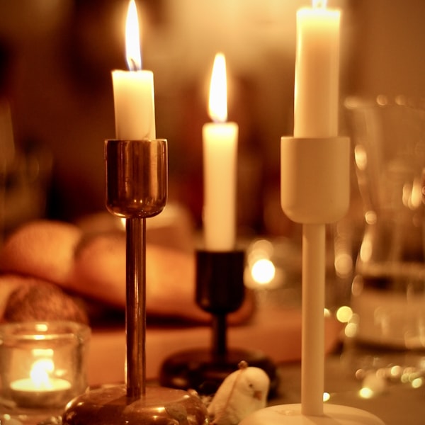 Warm candlelight from artisan candle holders creating a cozy home atmosphere